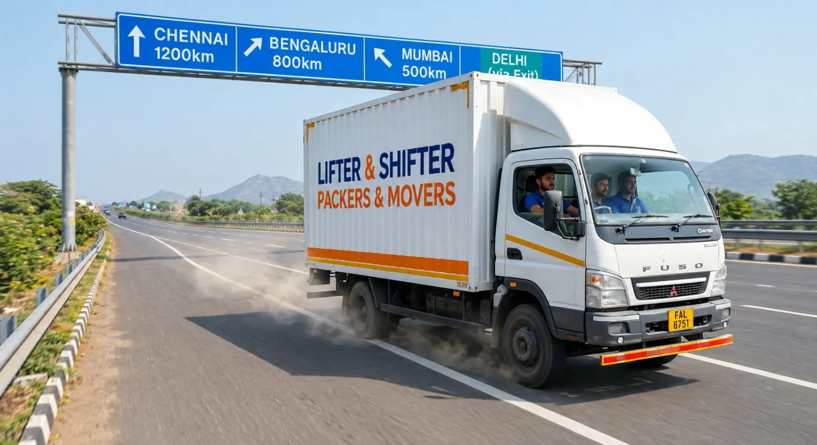 A white moving truck speeds along a highway beneath signs for Chennai, Bengaluru, Mumbai and Delhi